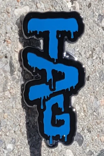 TAG - 1.25" x 0.625" Lapel Pin
